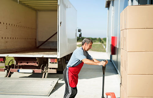 First Lane Deliveries employee unloading truck load